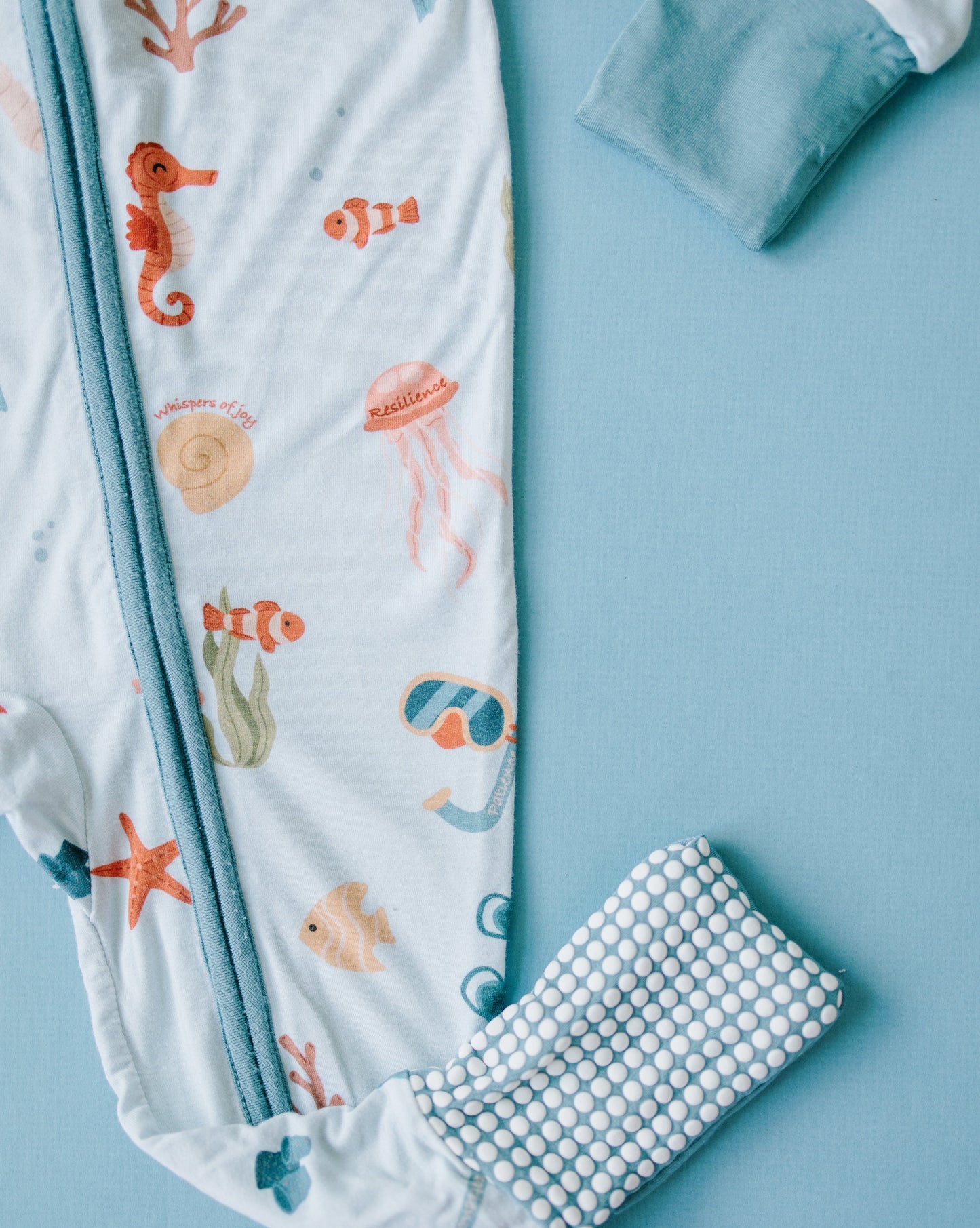 Little sleepies baby bamboo pajamas with mushroom print and words of affirmation for kids and mothers. Whispers of joy and resilience