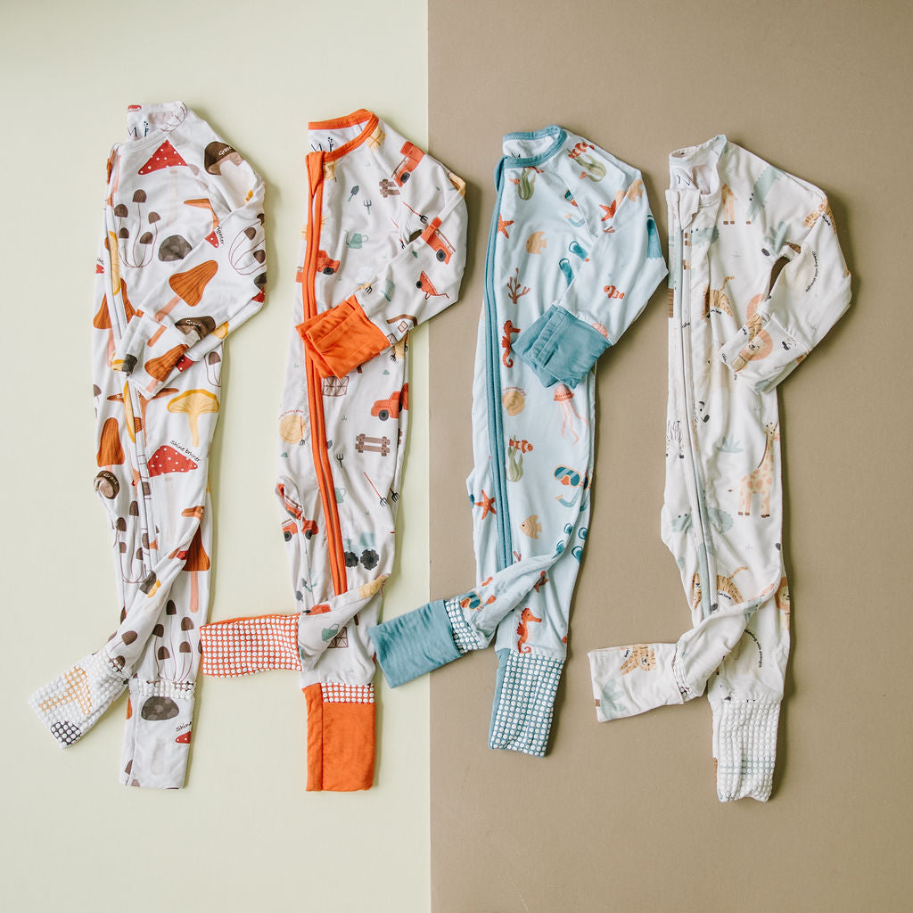 Little sleepies baby bamboo pajamas laying flat with words of affirmation for kids and mothers