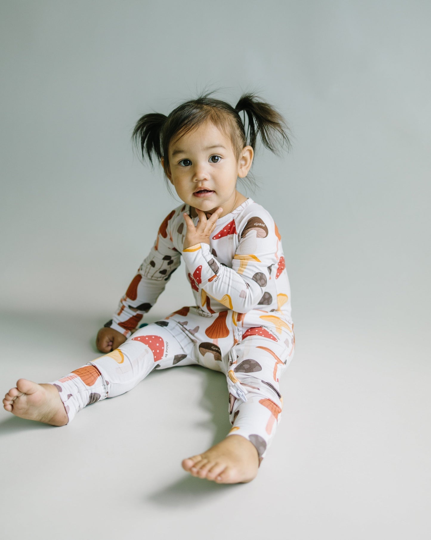 Little sleepies baby bamboo pajamas with mushroom print and words of affirmation for kids and mothers.