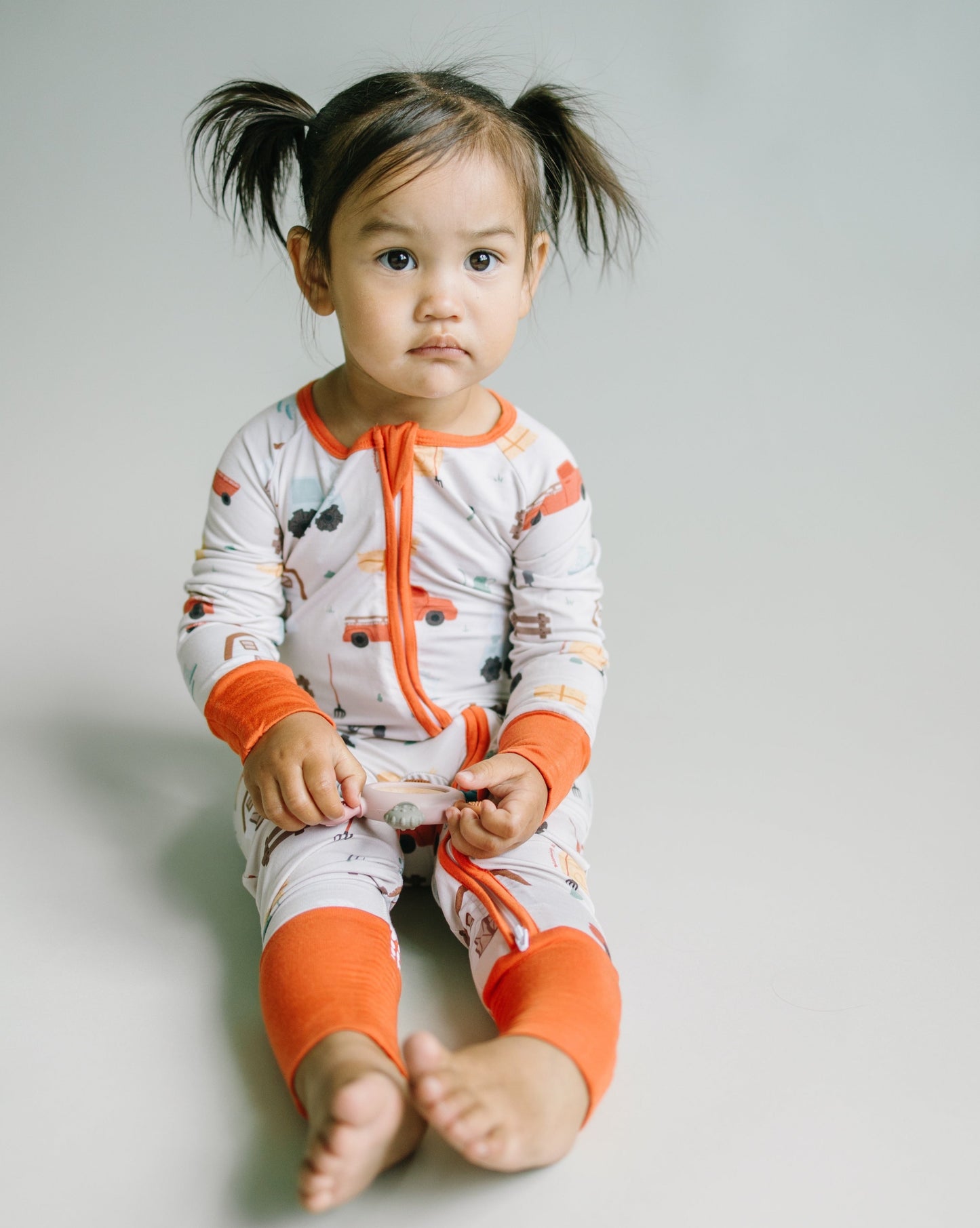 Little sleepies baby bamboo pajamas with mushroom print and words of affirmation for kids and mothers. Beautiful burnt orange color